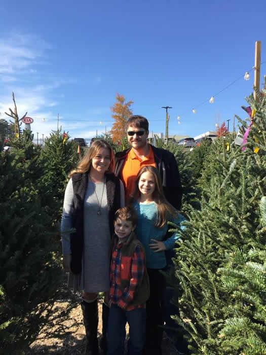 Image may contain: 4 people, people standing, sky, tree, plant, outdoor and nature